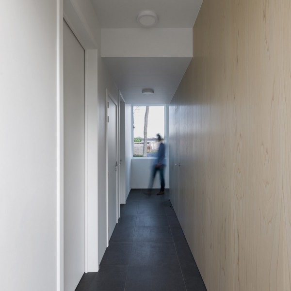 Joshua Florquin uses angular joinery to create bespoke furnishings for doctor's surgery in Maldegem, Belgium