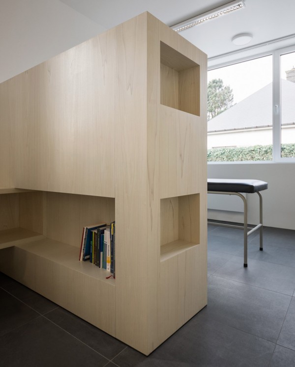 Joshua Florquin uses angular joinery to create bespoke furnishings for doctor's surgery in Maldegem, Belgium