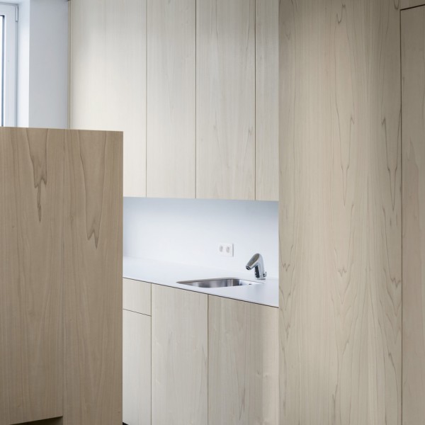 Joshua Florquin uses angular joinery to create bespoke furnishings for doctor's surgery in Maldegem, Belgium