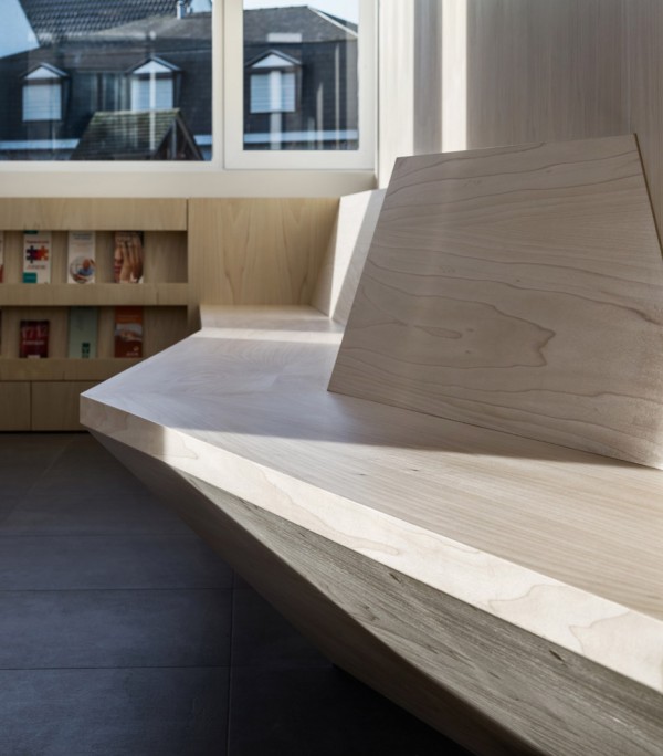 Joshua Florquin uses angular joinery to create bespoke furnishings for doctor's surgery in Maldegem, Belgium
