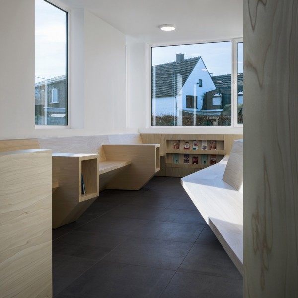 Joshua Florquin uses angular joinery to create bespoke furnishings for doctor's surgery in Maldegem, Belgium