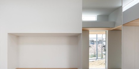 Mirrors and white walls draw light through House in Okazaki by Kazuki Moroe Architects
