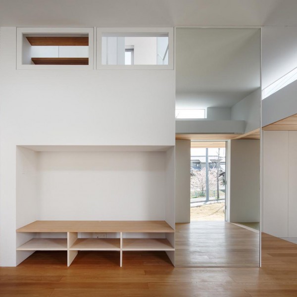 Mirrors and white walls draw light through House in Okazaki by Kazuki Moroe Architects