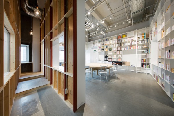 Hue Plus kitchen studio and library housed in a renovated warehouse building in Tokyo, Japan by Schemata Architects