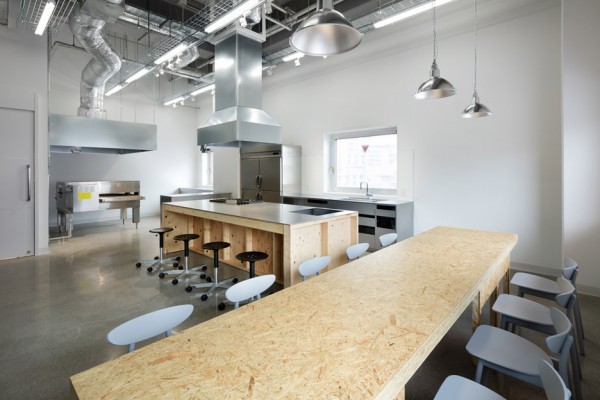 Hue Plus kitchen studio and library housed in a renovated warehouse building in Tokyo, Japan by Schemata Architects