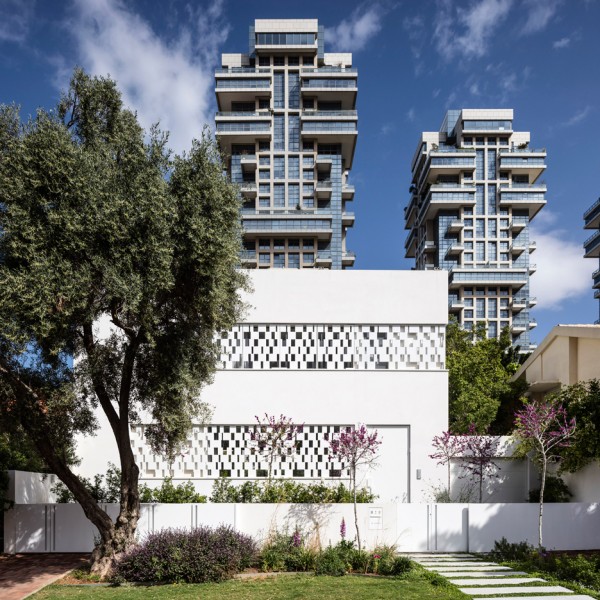 Perforated shutters create geometric facade for Pitsou Kedem’s house in Tel Aviv