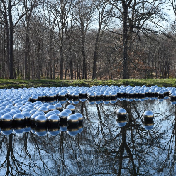 Narcissus Garden sculpture of mirrored spheres by Yayoi Kusama installed at Philip Johnson's Glass House in Connecticut