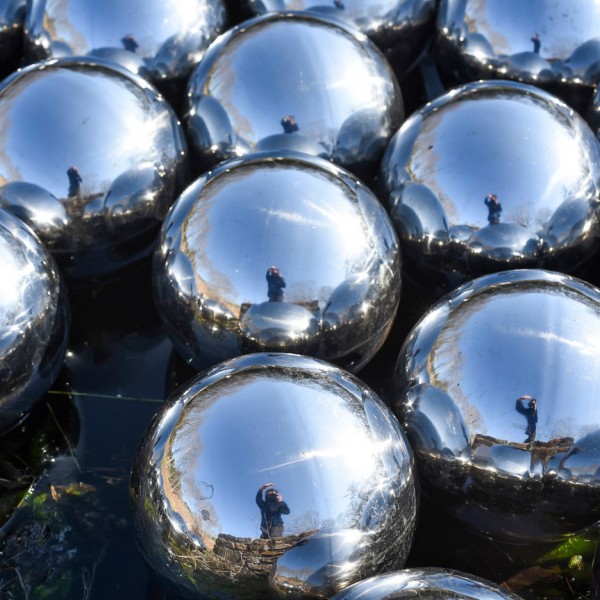 Narcissus Garden sculpture of mirrored spheres by Yayoi Kusama installed at Philip Johnson's Glass House in Connecticut