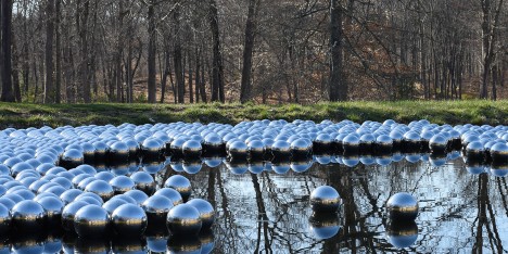 Narcissus Garden sculpture of mirrored spheres by Yayoi Kusama installed at Philip Johnson's Glass House in Connecticut