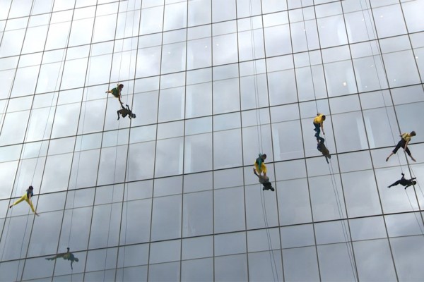 Mid-air dancing performance on the side of 100 North Avenue in Boston, Massachusetts, USA by Bandaloop