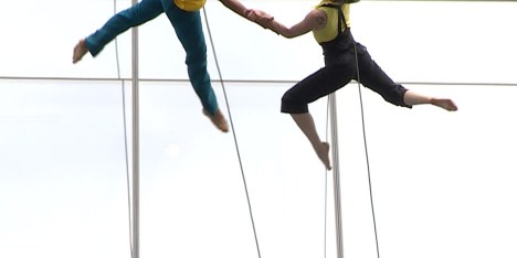 Mid-air dancing performance on the side of 100 North Avenue in Boston, Massachusetts, USA by Bandaloop