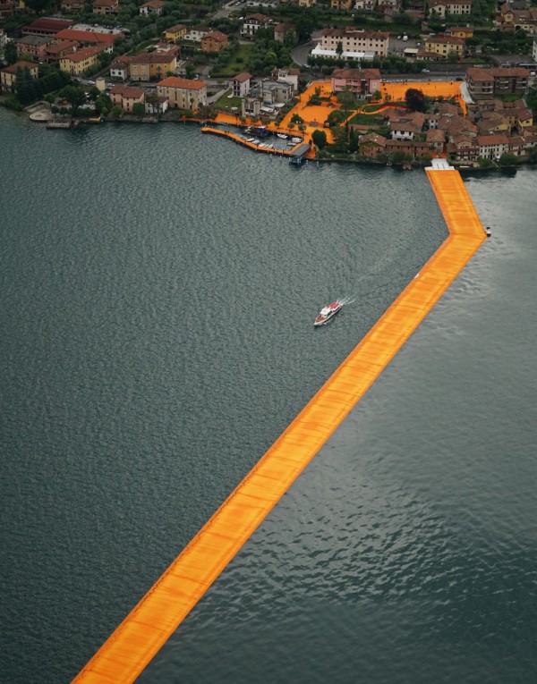 The Floating Piers project by Christo features bright orange pathways across Italy's Lake Iseo