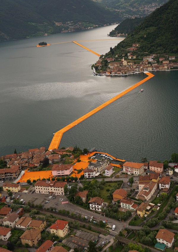The Floating Piers project by Christo features bright orange pathways across Italy's Lake Iseo
