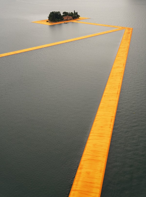 The Floating Piers project by Christo features bright orange pathways across Italy's Lake Iseo
