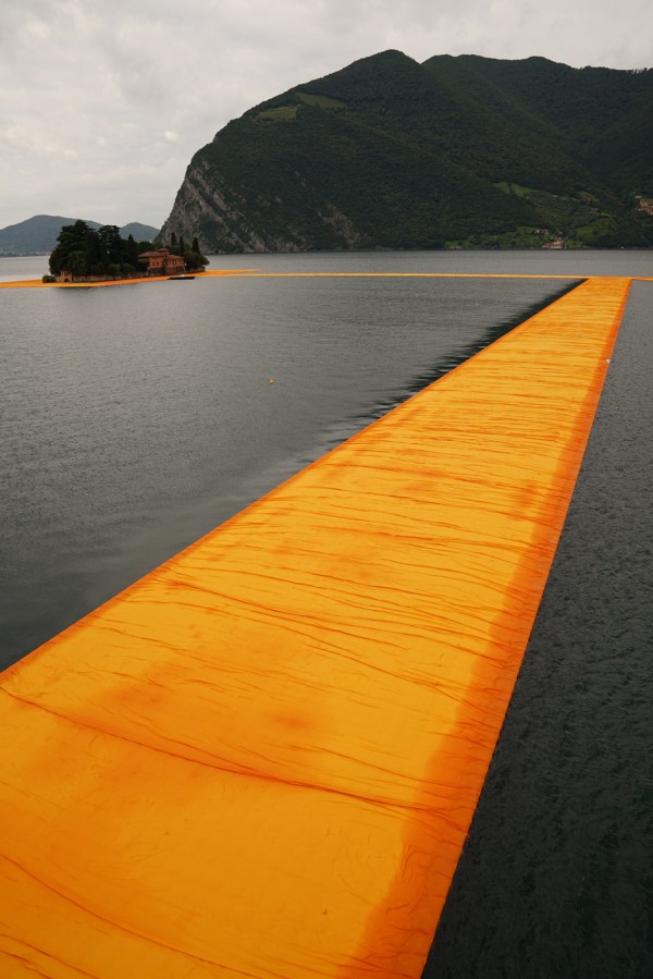 The Floating Piers project by Christo features bright orange pathways across Italy's Lake Iseo