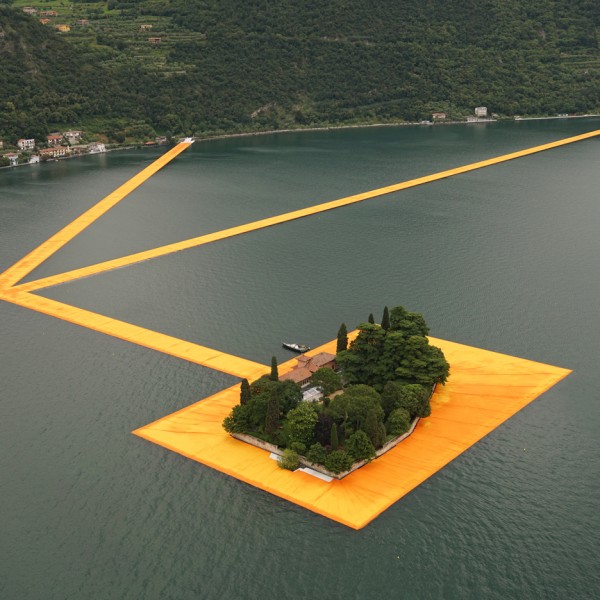 The Floating Piers project by Christo features bright orange pathways across Italy's Lake Iseo