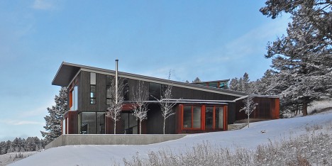 The Mountain House in Montana by Johnsen Schmaling Architects is clad with charred wood