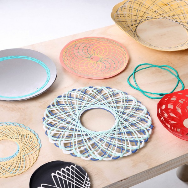 Spirograph Lab by Shawn Yang is a machine that alllows the 2D spirograph pattern to become 3D