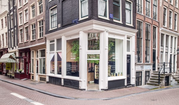 The Cold Pressed Juicery in Amsterdam designed by Standard Studio houses a living tree
