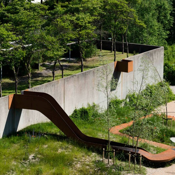 Holscher Nordberg Architects creates play area framed by a single metal ribbon