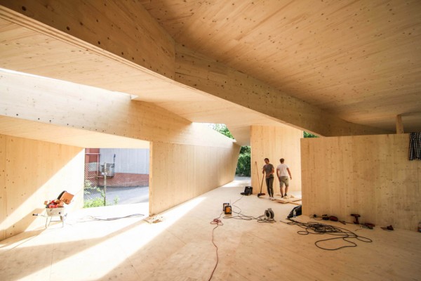 Bilding is a faceted wooden community centre built by students