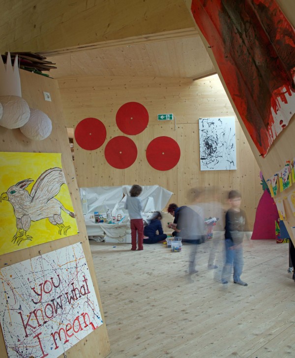 Bilding is a faceted wooden community centre built by students
