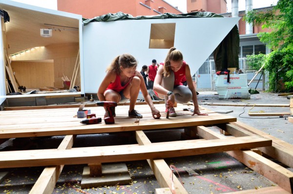 Bilding is a faceted wooden community centre built by students