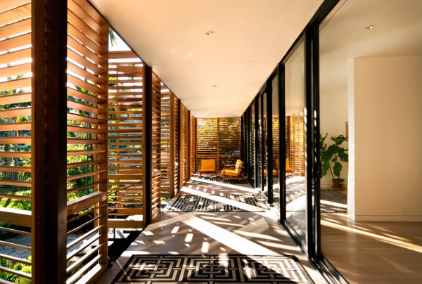 Florida-based studio Brillhart Architecture has completed a home fronted by slatted wooden shutters in a lush Miami forest