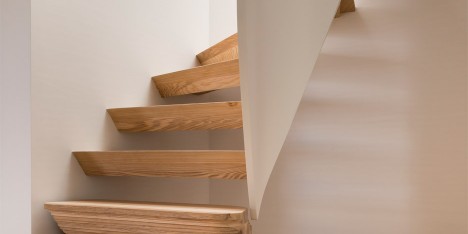 Twisted staircase features in Casa Vota renovation by 51 Architecture