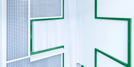 Adam Wiercinski creates denture clinic with green cross interior for Dent Protetyka