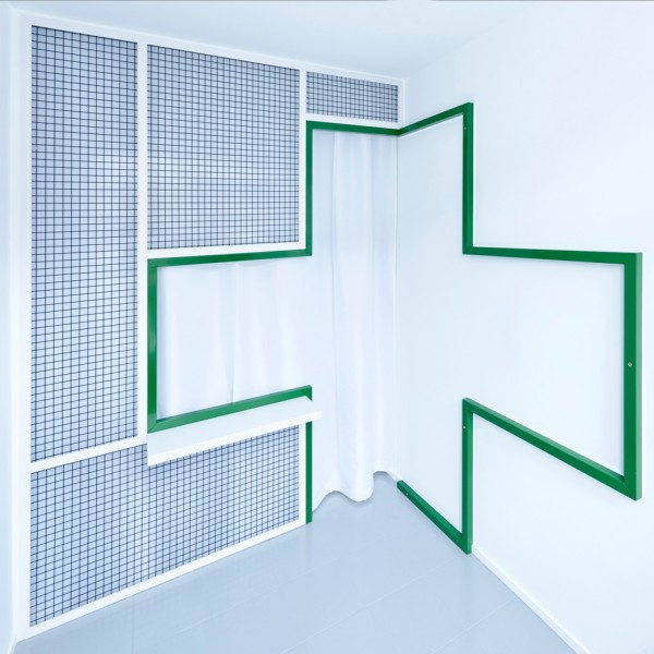 Adam Wiercinski creates denture clinic with green cross interior for Dent Protetyka