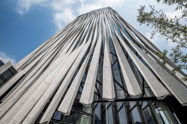 Strips of pleated aluminium are added to the facade of this Shanghai tower by Kengo Kuma