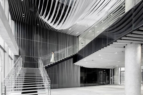 Strips of pleated aluminium are added to the facade of this Shanghai tower by Kengo Kuma