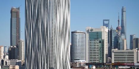 Strips of pleated aluminium are added to the facade of this Shanghai tower by Kengo Kuma