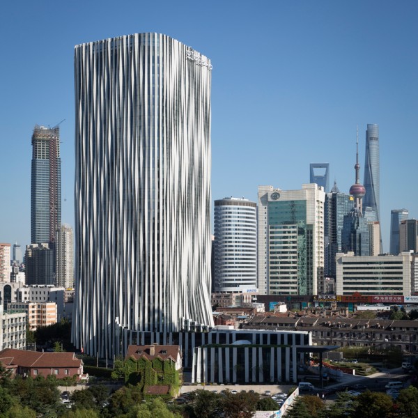 Strips of pleated aluminium are added to the facade of this Shanghai tower by Kengo Kuma