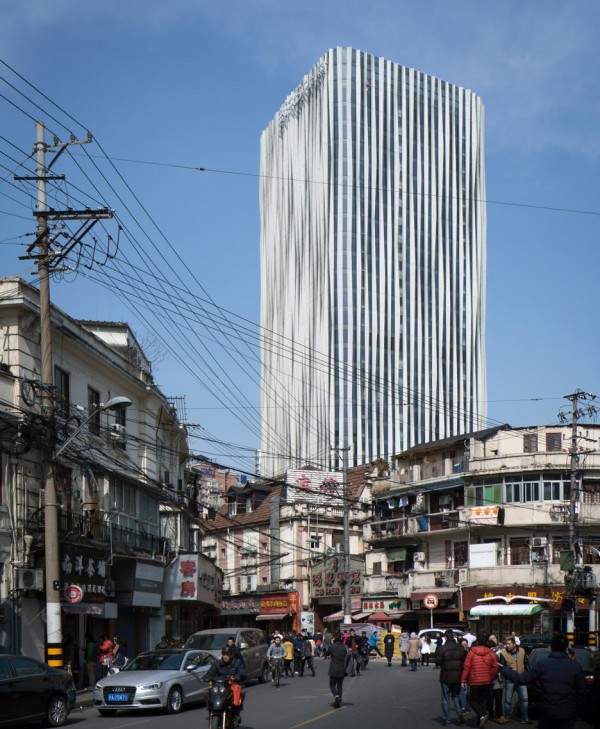 Strips of pleated aluminium are added to the facade of this Shanghai tower by Kengo Kuma