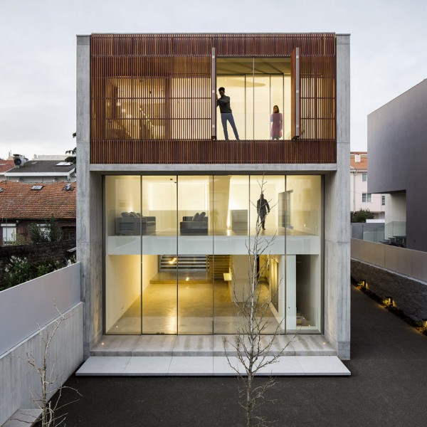 AZO Sequeira mask glazed walls with wooden screens in this house in Porto