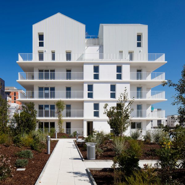 Gabled penthouses sit atop apartment blocks at Bordeaux housing scheme