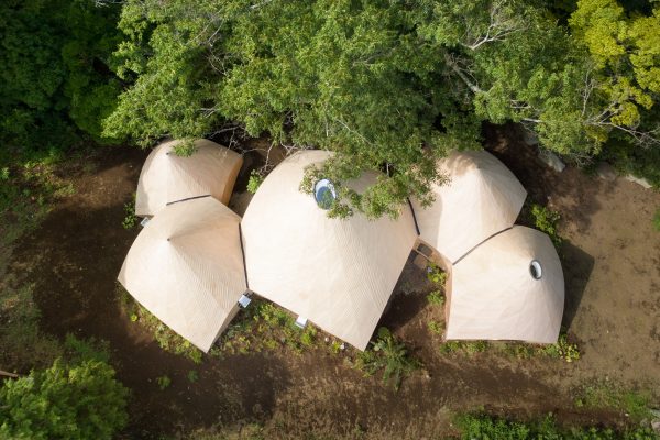 Teepee-shaped Jikka complex by Issei Suma features community kitchen and spiral-shaped pool