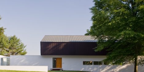 Robert Gurney’s waterfront Buisson Residence is capped with a folded copper roof