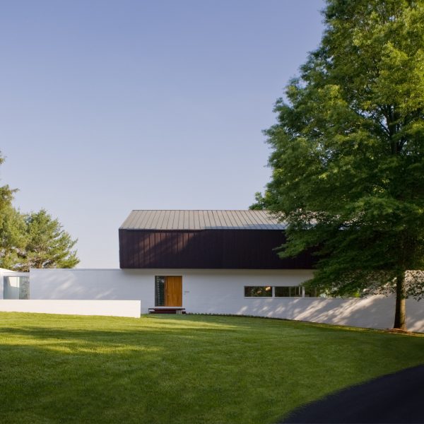 Robert Gurney’s waterfront Buisson Residence is capped with a folded copper roof