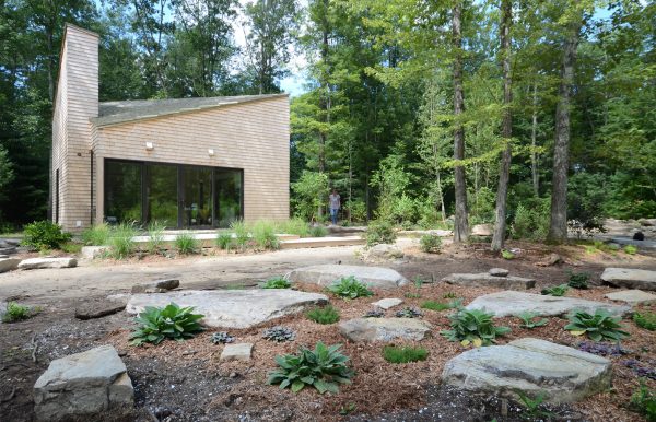 Cottage in woods by 3six0 Architecture