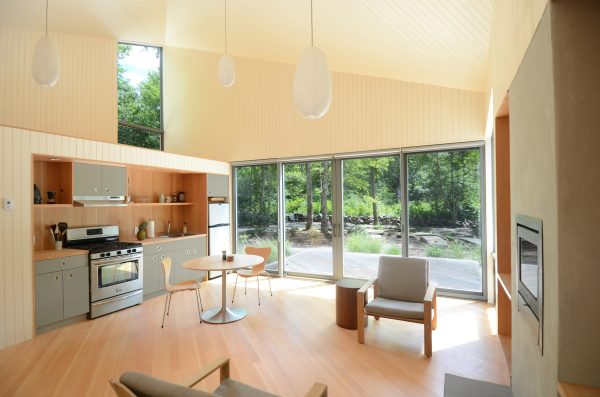 Cottage in woods by 3six0 Architecture