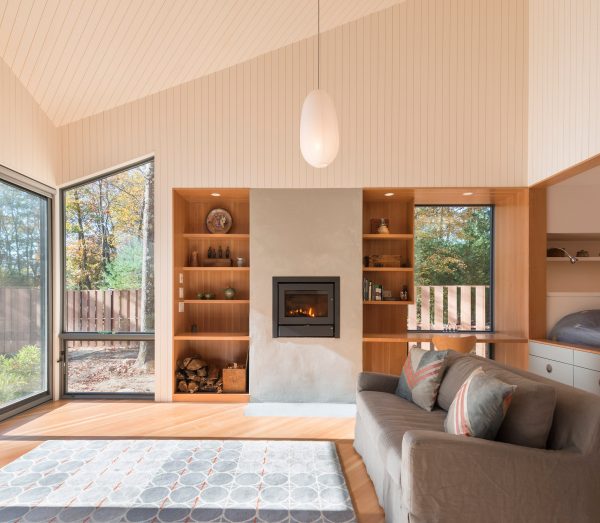 Cottage in woods by 3six0 Architecture