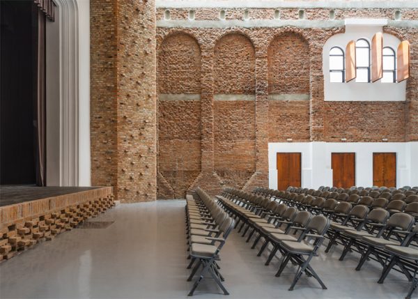 Ruined "cultural palace" in Romania revived by architect Vlad Rusu
