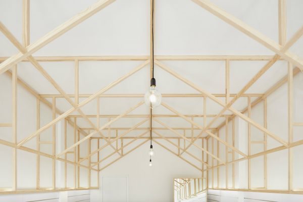 Bruno Lucas Dias adds timber skeleton to Portuguese accessories boutique