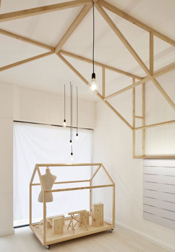 Bruno Lucas Dias adds timber skeleton to Portuguese accessories boutique