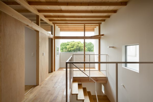 House in Mikage by Sides Core contrasts white surfaces with exposed wooden beams