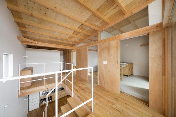 House in Mikage by Sides Core contrasts white surfaces with exposed wooden beams