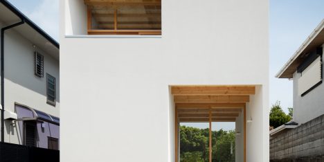House in Mikage by Sides Core contrasts white surfaces with exposed wooden beams
